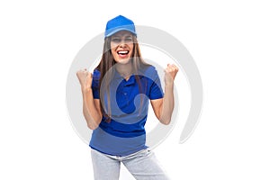 active young caucasian brunette advertiser woman in blank blue t-shirt and cap for brand print