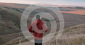 active young male runner run down mountain trail, skyrunning race ultramarathon