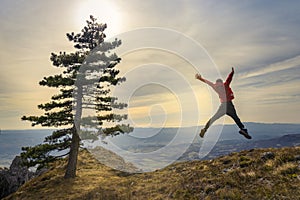 Active young man feeling free. Experience freedom in the heart of nature