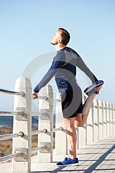 Active young man standing on one legs