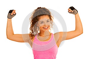 Active young sporty fit woman gesture power with her arms up iso