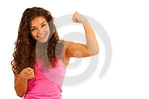 Active young sporty fit woman gesture power with her arms up iso