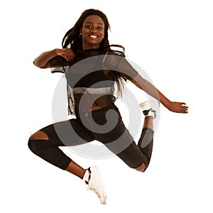 Active young woman dancer jumps in the air isolated over white b