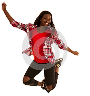 Active young woman dancer jumps in the air isolated over white b