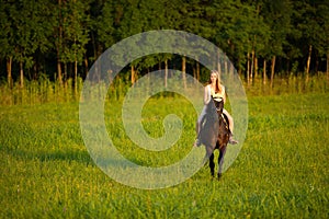 Active young woman ride a horse in nature