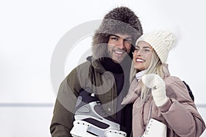 Active Youth Lifestyle. Young Loving  Caucasian Couple On Skatingrink With Ice Skates Posing Together Embraced Over a Snowy Winter