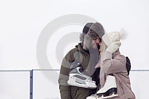 Active Youth Lifestyle. Young Loving  Caucasian Couple On Skatingrink With Ice Skates Posing Together Embraced Over a Snowy Winter