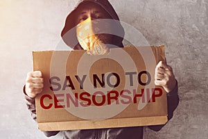 Activist holding Say No To Censorship protest sign photo