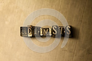 ACTIVISTS - close-up of grungy vintage typeset word on metal backdrop