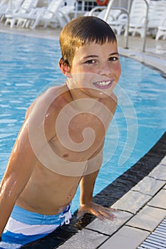 Activities on the pool. boy swimming and playing in water i