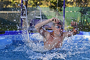 Activities on the pool, children swimming and playing in water, happiness and summertime