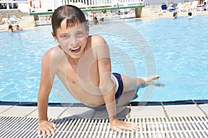 Activities on the pool. Cute boyplaying in swimming pool