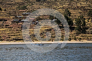 Activity of fishermen and their boats in the LlachÃ³n peninsula on Lake Titicaca. photo