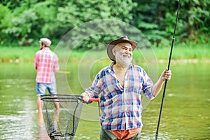 Activity and hobby. Happy cheerful people. Master baiter. Fisherman with fishing rod. Fishing freshwater lake pond river