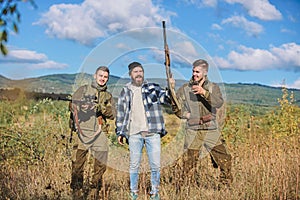 Activity for real men concept. Hunters gamekeepers looking for animal or bird. Hunters with rifles in nature environment