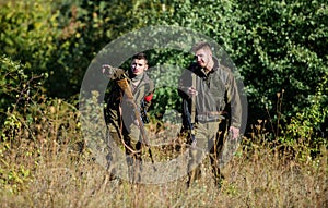 Activity for real men concept. Hunters gamekeepers looking for animal or bird. Hunting with friends. Hunters friends