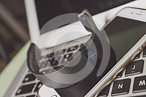 Activity tracker placed on laptop and phone