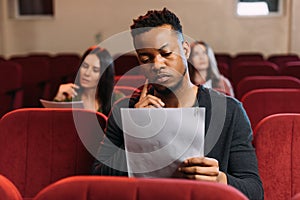 Actor and actresses reading scripts in