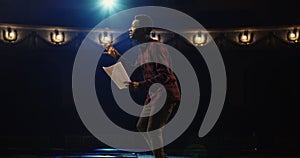 Actor performing a monologue in a theater