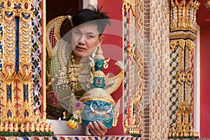 an actor portraying Ravana in a Khon drama, a traditional Thai masked play based on the Ramayana. The actor holds a intricately