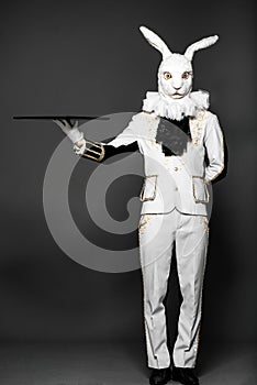 Actor posing in white rabbit suit with tray on