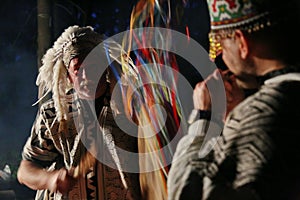 Actors in costumes of South American shamans.