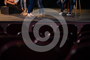 Actors practicing play on stage in theatre