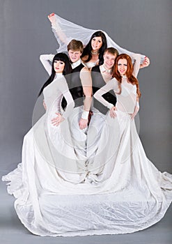 Actors in the wedding dress posing.