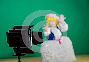 The actress shot on a green background. Lighting equipment in the Studio