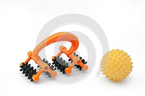 Acupressure body massager and massage ball on a white background