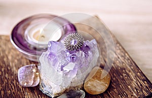 Acupressure massage ring on amethyst crystal cluster. Acupressure is an alternative medicine technique with physical pressure is a