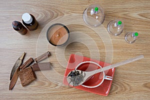 Acupuncture needles, herbs, cup, oil, TCM Traditional Chinese Medicine concept photo photo