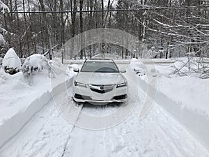 Acura TLX AWD in the snow in winter with lights on