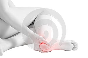 Acute pain in a woman ankle isolated on white background. Clipping path on white background.