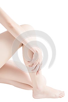 Acute pain in a woman shin isolated on white background. Clipping path on white background.