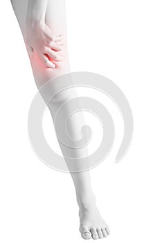 Acute pain in a woman thigh isolated on white background. Clipping path on white background.
