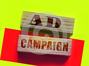 Ad campaign words on wooden blocks. Advertising marketing promotion concept