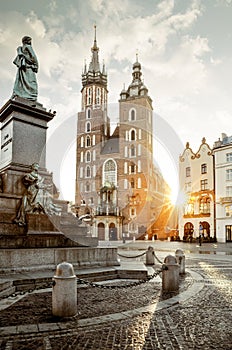 Adam Mickiewicz monument and St. Mary`s Basilica on Main Square in Krakow photo