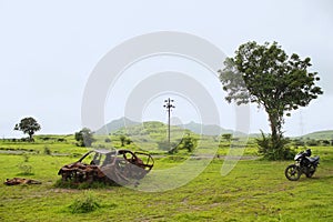 Adandoned rusted car in the field, Maharashtra, India