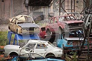 The adandoned scrapyard with cars photo