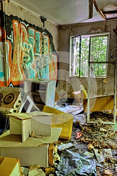 Adandoned trashed house with graffifi on walls