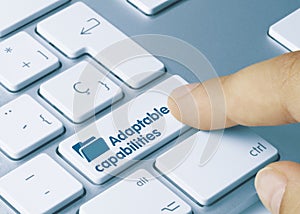 Adaptable capabilities - Inscription on Blue Keyboard Key photo