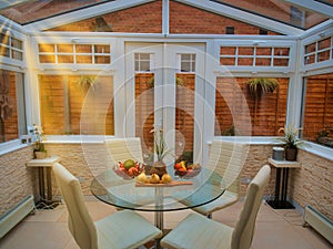 An adapted coach house conservatory, english garden suburb