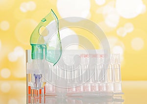 Adapted for inhalation, a mask, spare ampoules on a yellow flick