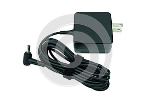 Adapter ac/dc power charger of laptop computer isolated on white photo