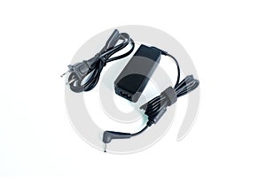 Adapter ac/dc power charger with wire of laptop computer isolated on white
