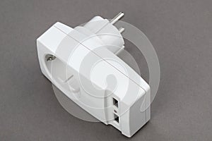 Adapter for an electrical outlet with two USB connectors