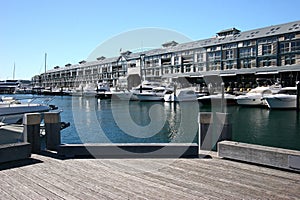 Adaptive reuse of building converted from industrial pier long building at marina with yachts, Woolloomooloo, Sydney, Australia