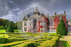 Adare castle in red ivy with gardens photo