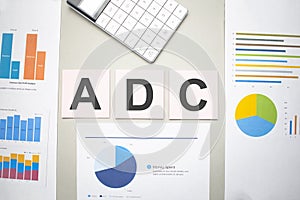 adc business, search engine optimazion,Text on the sheets of paper, charts and white calculator photo
